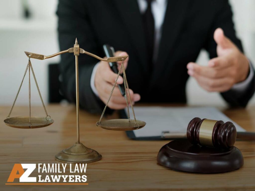 A family law attorney sitting behind a desk with scales of justice and a gavel, symbolizing child support legal services in Arizona