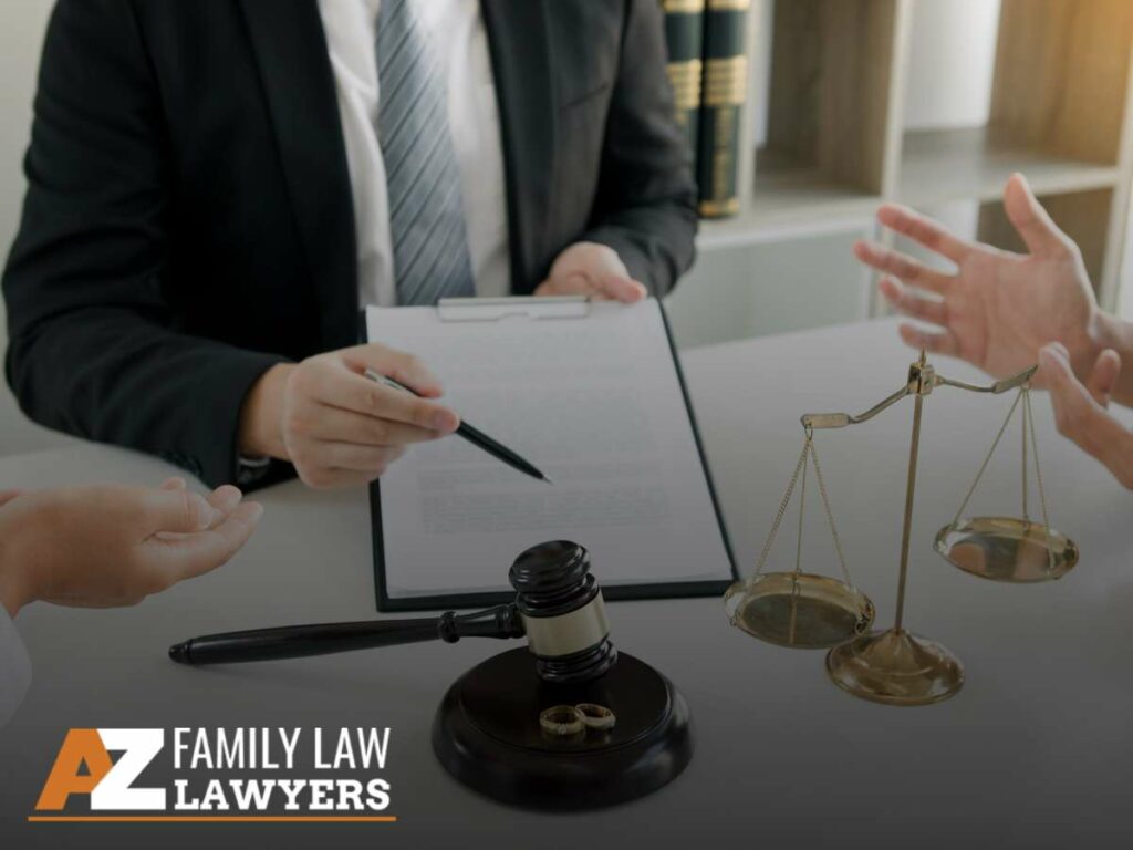 Lawyer mediating a discussion with a couple beside legal documents, scales, and wedding rings, symbolizing Divorce proceedings.
