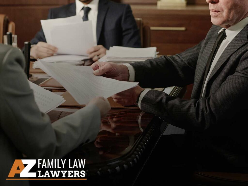 Divorce couple with an attorney reviewing legal documents in a meeting