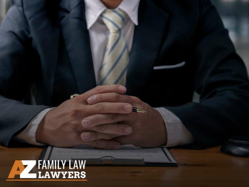 Divorce attorney reviewing documents at desk