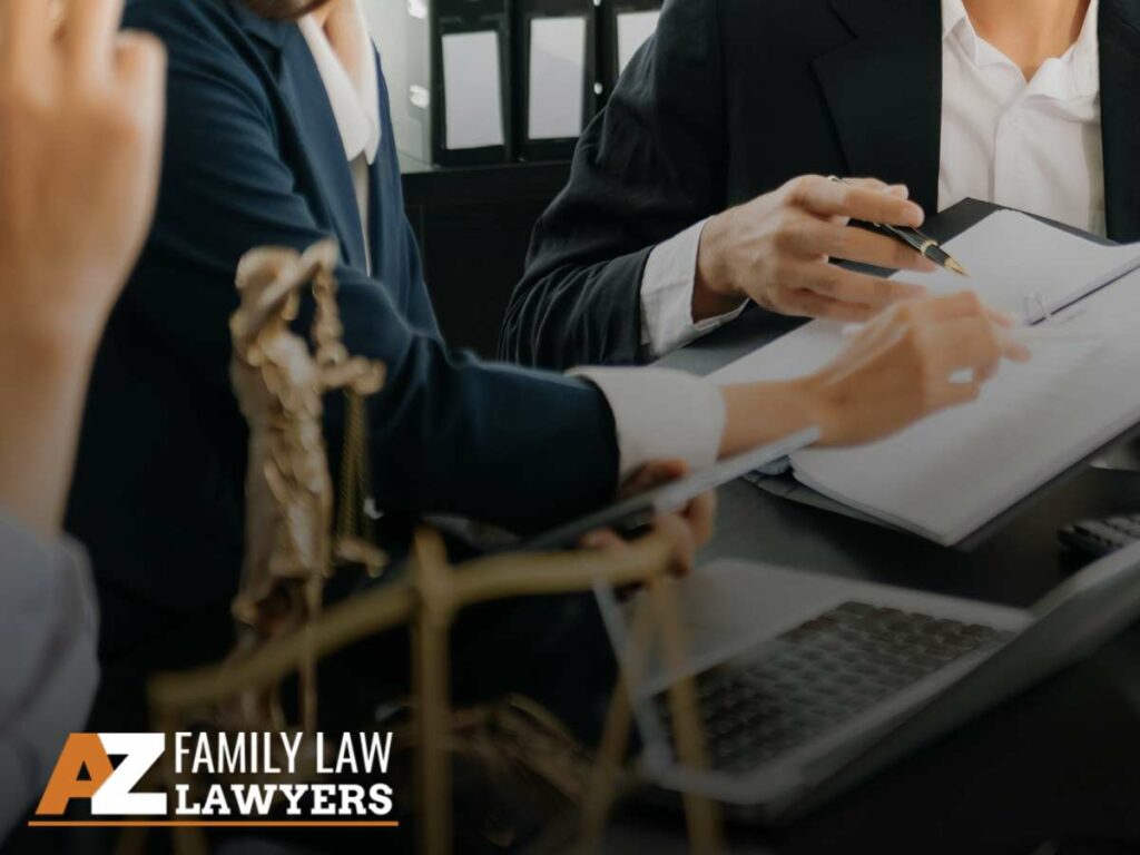 Attorney Reviewing Divorce In Arizona Documents with a couple